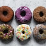 6 colorful donuts photographed from above