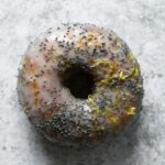 a lemon poppy seed donut photographed from above