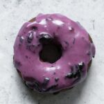 a blueberry old fashioned donut photographed from above
