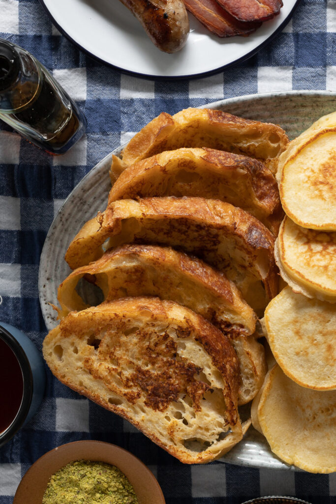 savory French toast with no toppings on a blue gingham tablecloth