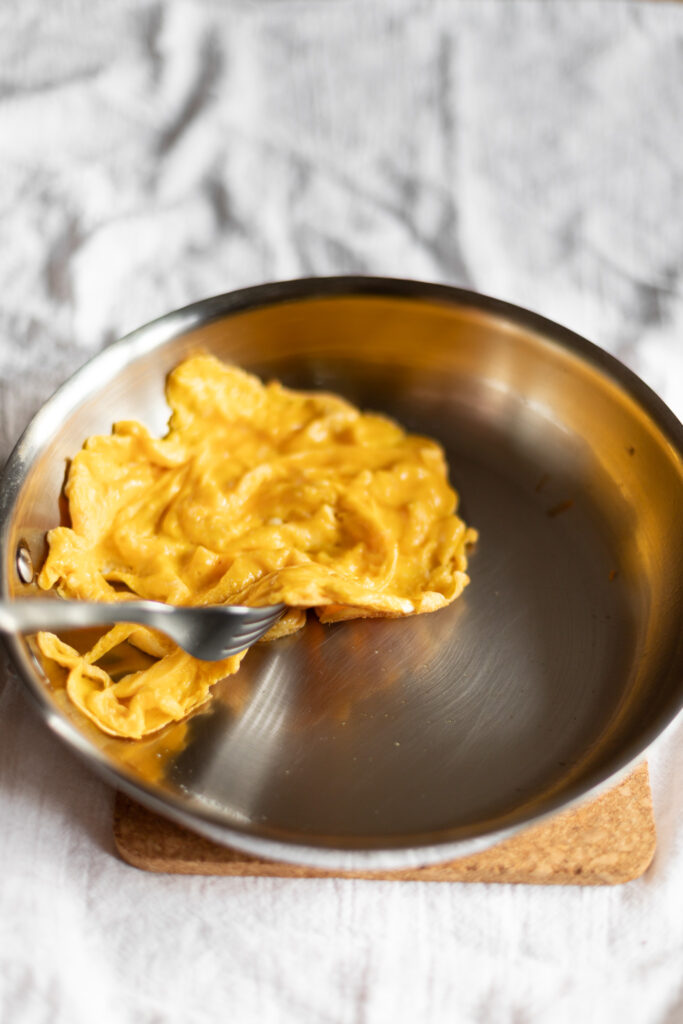 eggs in a stainless steel skillet