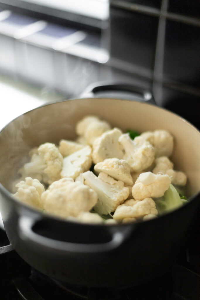 cauliflower steaming in a pot