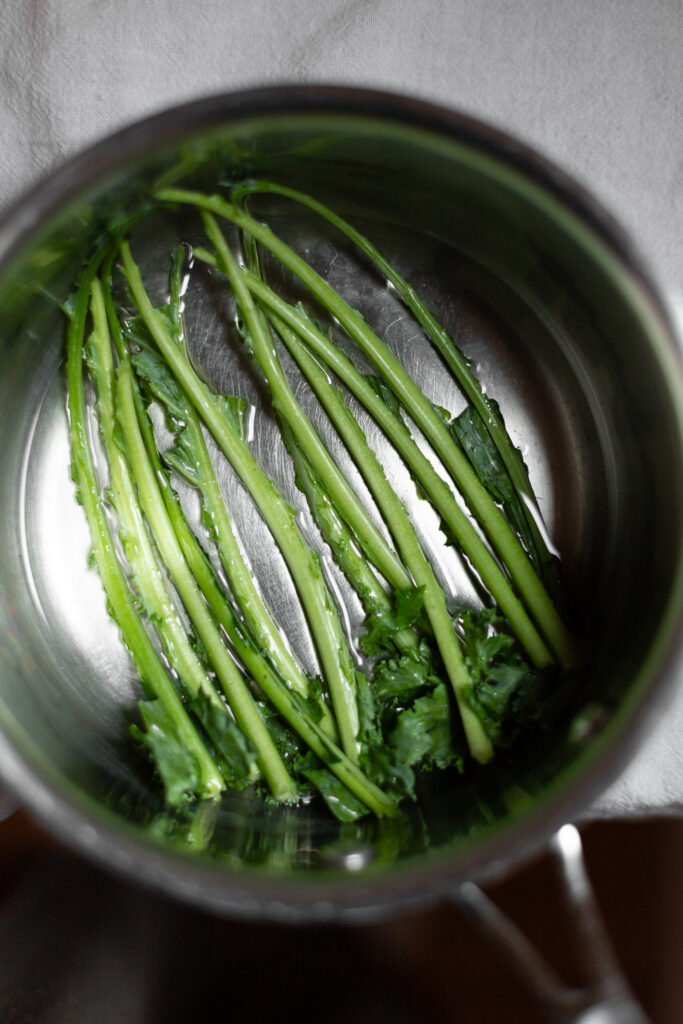 kale stems in a saucepan