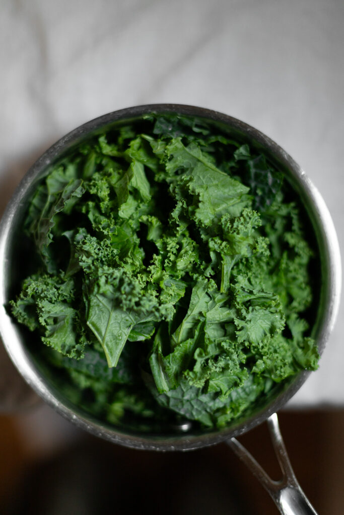 raw kale in a saucepan